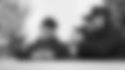 Seattle Seahawks head coach Mike Macdonald, middle, smiles next to president of football operations/general manager John Schneider, right, after the NFC Championship NFL football game against the Los Angeles Rams. Sunday, Jan. 25, 2026, in Seattle. (AP Photo/Lindsey Wasson)