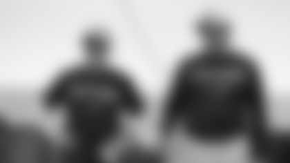 Carolina Panthers head coach Ron Rivera, right, and defensive coordinator Sean McDermott, left, watch practice during the NFL football team's training camp in Spartanburg, S.C., Wednesday, Aug. 5, 2015. (AP Photo/Chuck Burton)