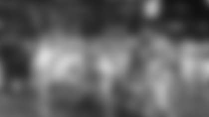 Carolina Panthers quarterback Cam Newton (1) poses for a photo with teammates following an NFL football game against the Atlanta Falcons at the Georgia Dome on Sunday, December 28, 2014, in Atlanta, GA. The Panthers defeated the Falcons 34-3. (AP Photo/Perry Knotts)