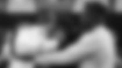 North Carolina State offensive lineman Ickey Ekwonu celebrates in the green room with his family after being selected sixth overall by the Carolina Panthers during the 2022 NFL Draft on Thursday, April 28, 2022 in Las Vegas. (Ben Liebenberg via AP)