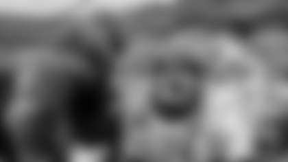 Carolina Panthers offensive tackle Taylor Moton, left, and center Austin Corbett, middle, speak with Seattle Seahawks quarterback Sam Darnold, right, following an NFL football game, Sunday, Dec. 28, 2025, in Charlotte, N.C. (AP Photo/Rusty Jones)