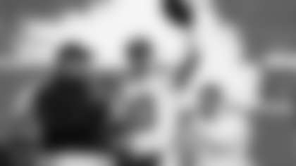 New England Patriots quarterback Drake Maye celebrates with the trophy after the AFC Championship NFL football game between the Denver Broncos and the New England Patriots, Sunday, Jan. 25, 2026, in Denver. (AP Photo/John Locher)