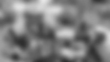 Carolina Panthers quarterback Randy Fasani (12) is sacked by Tampa Bay Buccaneers' Simeon Rice in the fourth quarter of the Buccaneers' 12-9 win in Charlotte, N.C., Sunday, Oct. 27, 2002. (AP Photo/Mike McCarn)