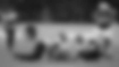 Atlanta Falcons defensive ends Jalon Walker (11) and James Pearce Jr. (27) scramble for the ball after Indianapolis Colts quarterback Daniel Jones, center, fumbled during an NFL football game in Berlin, Germany, Sunday, Nov. 9, 2025. (Doug Benc/AP Content Services for the NFL)