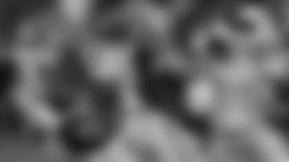 Florida quarterback Graham Mertz, left, looks for a receiver as offensive lineman Austin Barber, center, blocks Texas A&M defensive lineman Shemar Stewart (4) during the second half of an NCAA college football game, Saturday, Sept. 14, 2024, in Gainesville, Fla. (AP Photo/John Raoux)