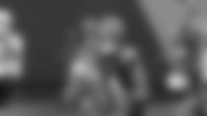 Tetairoa McMillan catches the Bryce Young 11-yard pass despite tight Bucs coverage