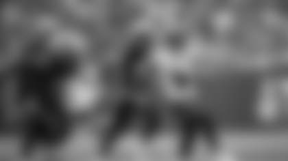 Tampa Bay Buccaneers wide receiver Emeka Egbuka (2) runs after catching a pass as New England Patriots safety Jaylinn Hawkins (21) and safety Craig Woodson (31) follow during the first half of an NFL football game, Sunday, Nov. 9, 2025, in Tampa, Fla. (AP Photo/Phelan M. Ebenhack)