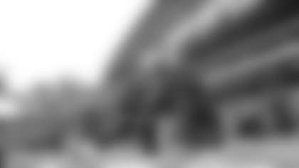 Seattle Seahawks quarterback Russell Wilson, left, prays with wide receivers coach Dave Canales, right, during warmups before an NFL football game against the Washington Redskins, Sunday, Nov. 5, 2017, in Seattle. (AP Photo/Elaine Thompson)