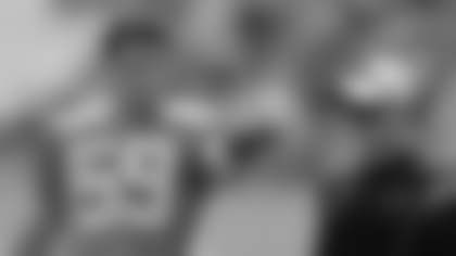 Carolina Panthers' Luke Kuechly (59) talks with defensive coordinator Sean McDermott, right, during an NFL football training camp practice in Spartanburg, S.C., Saturday, July 27, 2013. (AP Photo/Chuck Burton)