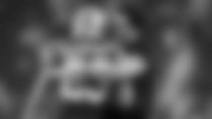 San Francisco 49ers running back Christian McCaffrey (23) hugs Luke Kuechly before an NFL football game against the Carolina Panthers, Monday, Nov. 24, 2025, in Santa Clara, Calif. (AP Photo/Eakin Howard)