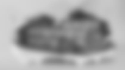 Caedan Wallace's cleats supporting Heading Home.