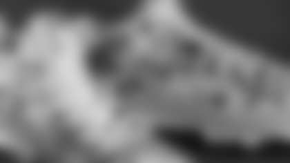 Christian Elliss's cleats supporting Compassion International Inc.