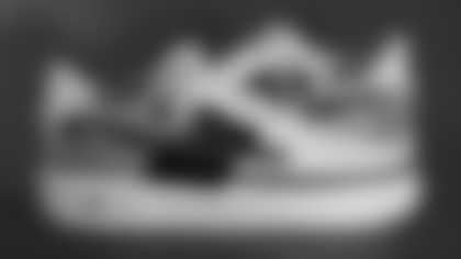 Offensive Assistant Chuckie Keeton's sneakers supporting Fellowship of Christian Athletes.