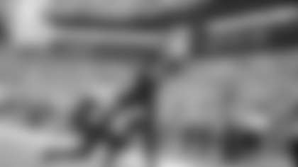 Stefon Diggs catches a 1-yard pass from Drake Maye to score a touchdown in the second quarter.