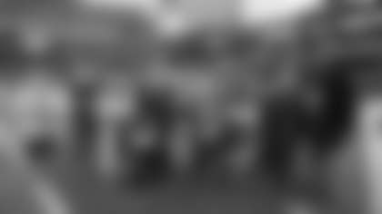 Chairman and CEO of the Kraft Group and the New England Patriots Robert Kraft takes a group photo with the 2025 Patriots Difference Makers of the Week.