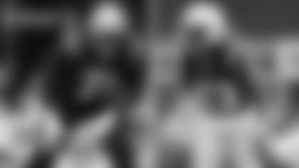 Pictured are Patriots offensive lineman Michael Onwenu (71) and defensive back Kyle Dugger (23).