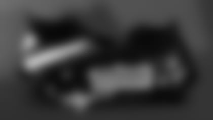 Jaylinn Hawkins cleats supporting United Sports Abroad.