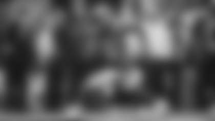 Los Angeles Rams quarterback Matthew Stafford rolls out of the pocket to throw a 19-yard pass to wide receiver Konata Mumpfield against the Seattle Seahawks at Lumen Field.