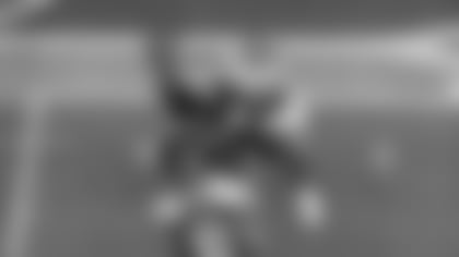 Los Angeles Rams defensive end Braden Fiske drops Seattle Seahawks quarterback Sam Darnold for a 5-yard loss at Lumen Field during their NFC Championship matchup.