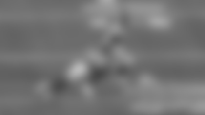 Los Angeles Rams inside linebacker Nate Landman takes down Seattle Seahawks quarterback Sam Darnold for a 1-yard sack at Lumen Field.