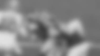 Los Angeles Rams outside linebacker Josaiah Stewart tackles Detroit Lions wide receiver Jameson Williams after a 1-yard rush during their Week 15 matchup at SoFi Stadium.