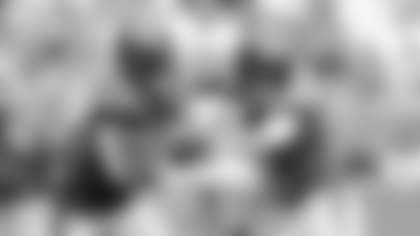 New York Jets quarterback Zach Wilson (2) hands the ball to running back Breece Hall (20) during the first half of an NFL football game against the Miami Dolphins, Sunday, Dec. 17, 2023, in Miami Gardens, Fla. (AP Photo/Rebecca Blackwell)