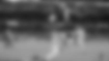 Notre Dame running back Jeremiyah Love (4) leaps over Army cornerback Donavon Platt to score a touchdown during the first half of an NCAA college football game at Yankee Stadium, Saturday, Nov. 23, 2024, in New York. (AP Photo/Adam Hunger)