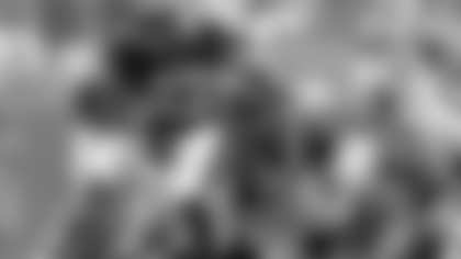 New Orleans Saints' Pierre Thomas (23) breaks away from Carolina Panthers' Jon Beason (52) and a crowd at the line during the first half of an NFL game in Charlotte, N.C., Sunday Sept. 16, 2012. The Panthers won 35-27. (AP Photo/Bob Leverone)