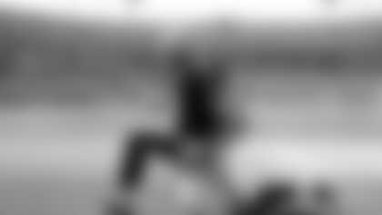 New Orleans Saints' Drew Brees (9) stretches just before an NFL football game against the Carolina Panthers in Charlotte, N.C., Sunday, Oct. 9, 2011. (AP Photo/Bob Leverone)