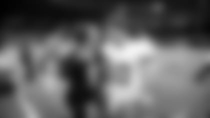 New Orleans Saints quarterback Drew Brees (9) and New York Giants quarterback Eli Manning (10) talk after their NFL football game in New Orleans, Monday, Nov. 28, 2011. THe Saints won 49-24. (AP Photo/Bill Haber)