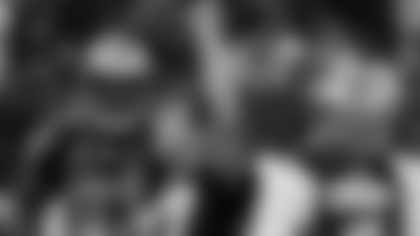 ormer New Orleans Saints football player Steve Gleason raises his hand to the crowd before the first half of an NFL football game against the Houston Texans, Sunday, Sept. 25, 2011, in New Orleans. New Orleans Saints quarterback Drew Brees (9) and New Orleans Saints defensive end Will Smith (91) look on.