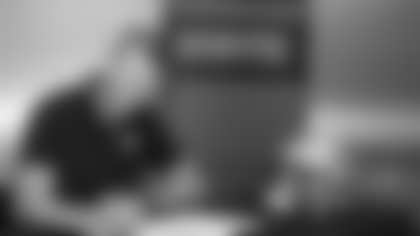 Members of the New Orleans Saints 2025 NFL Draft class sign their rookie contracts at the Ochsner Sports Performance Center.