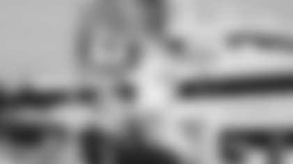 Canadian Seahawks fans boarding the Clipper V fast ferry beneath the flags of FRS Clipper, Canada, and 12 North.