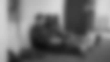 Outside of the locker room and hours before the preseason game against the Green Bay Packers, Seahawks head coach Mike Macdonald shares knowledge with defensive backs Devon Witherspoon and Coby Bryant.