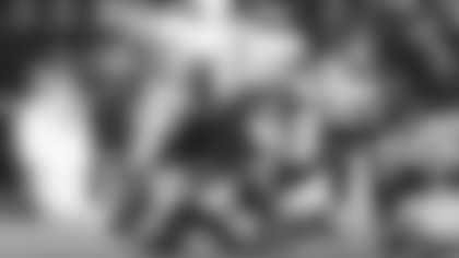 Los Angeles Rams linebacker Byron Young, below, tackles Tampa Bay Buccaneers quarterback Teddy Bridgewater, middle, as Los Angeles Rams safety Kam Curl, above, leaps during the second half of an NFL football game, Thursday, Nov. 23, 2025, in Inglewood, Calif. (AP Photo/Jessie Alcheh)