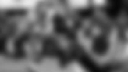 Los Angeles Rams wide receiver Puka Nacua (12) is tackled by Carolina Panthers safety Lathan Ransom (22) and cornerback Mike Jackson (2) during an NFL wild card playoff football game, Sunday, Jan. 10, 2026, in Charlotte, N.C. (AP Photo/Brian Westerholt)