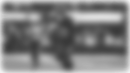 Quarterback Justin Herbert scrambles for a 28-yard gain.