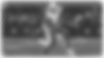 Wide receiver Quentin Johnston makes a 25-yard reception on a third-and-9.