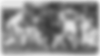 Running back Omarion Hampton rushes for a 5-yard touchdown.