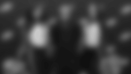 Eagles Cheerleaders Mieka and Deja pose for a photo with Donavan Myles Edwards, the writer and director of Last Minute Project.