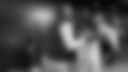 As players head to the locker room after the 33-15 win over the New York Giants Patriots head coach Mike Vrabel congratulates each player.