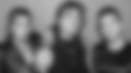 A headshot of We Three.