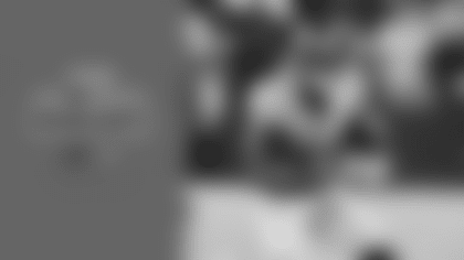 Seattle Seahawks quarterback Sam Darnold darts a 27-yard pass to wide receiver Jaxon Smith-Njigba in the second half of Thursday's divisional matchup with the Rams.