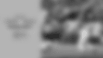 Seattle Seahawks running back Zach Charbonnet bursts through and leaps in for a 6-yard touchdown rush against the Arizona Cardinals in Week 10 at Lumen Field.