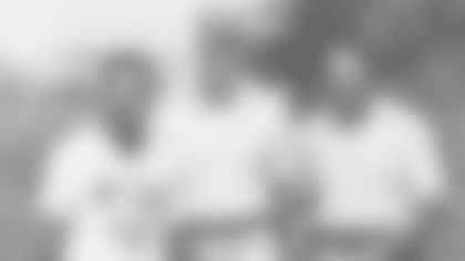 Leo Lewis and Dad with Bud Grant