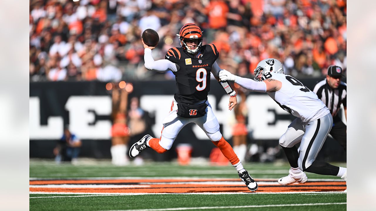 QB Joe Burrow escapes and completes a pass against the Las Vegas Raiders in Week 9 at Paycor Stadium, Sunday, November 3, 2024.