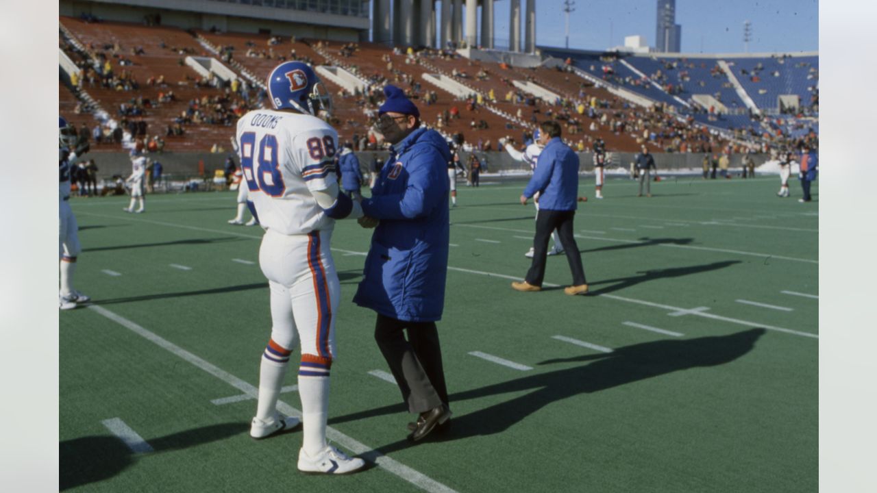 Denver Broncos tight end Riley Odoms (88) greets Broncos owner Edgar Kaiser before a game against the Chicago Bears at Soldier Field on December 20, 1981. Photo by Barry Staver