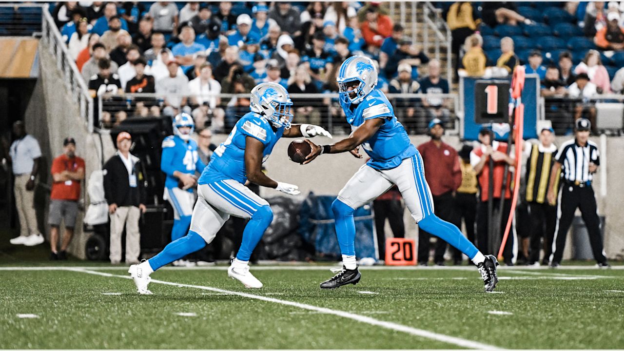 Detroit Lions running back Jabari Small (42) and Detroit Lions quarterback Hendon Hooker (2) during an NFL football game against the Los Angeles Chargers, Thursday, July 31, 2025, in Canton, Ohio. (Jeff Nguyen/Detroit Lions via AP)