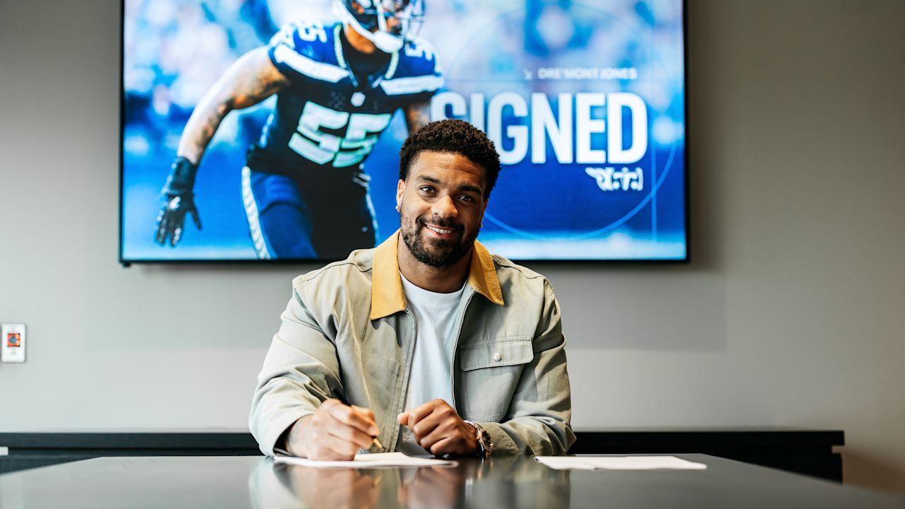 Dre'Mont Jones signs his contract at the Ascension Saint Thomas Sports Park on March 14, 2025 in Nashville, TN. Photo By Donald Page/Tennessee Titans