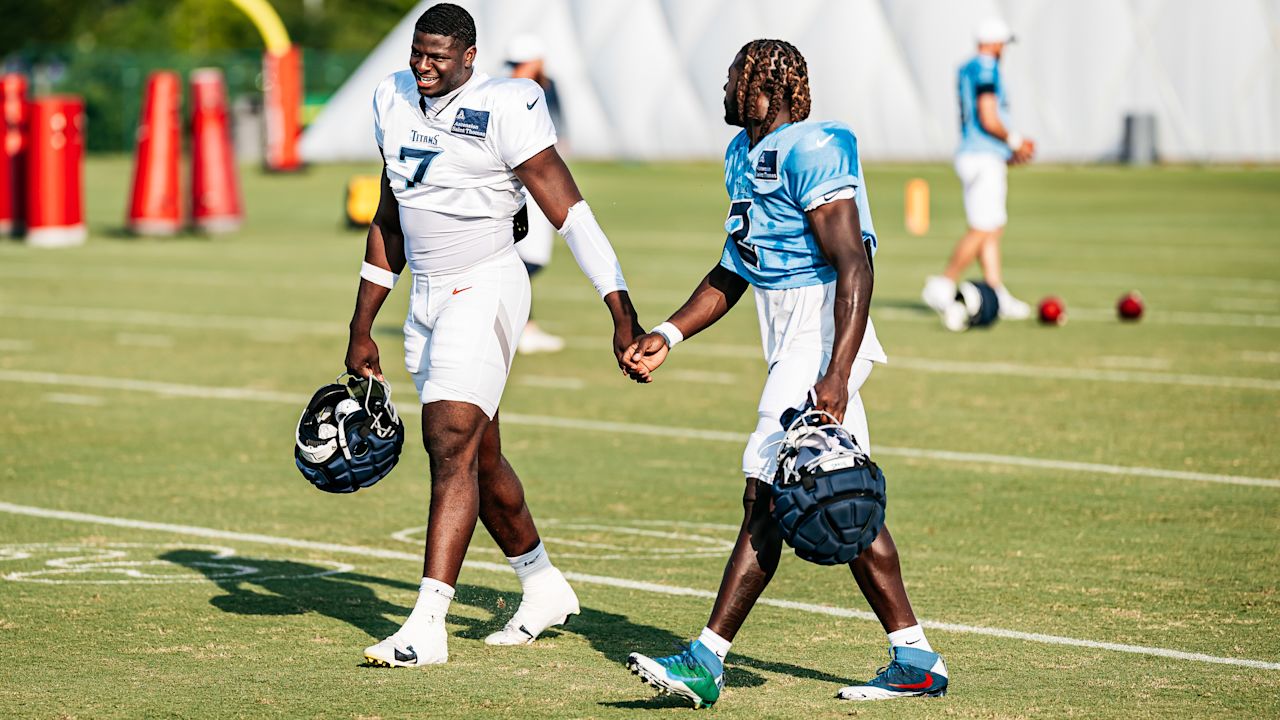 Outside linebacker Oluwafemi Oladejo #7 of the Tennessee Titans and Running back Tyjae Spears #2 of the Tennessee Titans during training camp practice at the Ascension Saint Thomas Sports Park on July 29, 2025 in Nashville, TN. Photo By Donald Page/Tennessee Titans